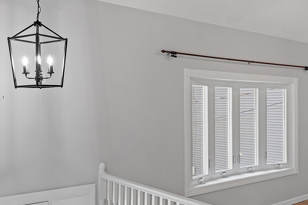 45 Bellflower Road Billerica, MA 01821 - Photo 4 of 42 a view of a hallway with windows and chandelier