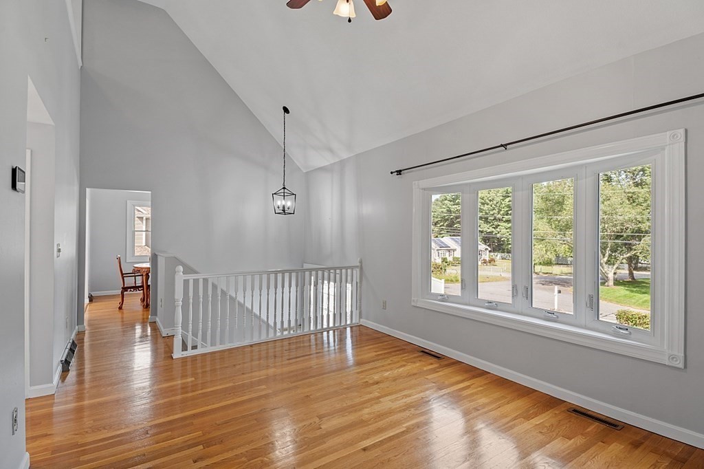 45 Bellflower Road Billerica, MA 01821 - Photo 7 of 42 a view of an empty room with wooden floor and a window
