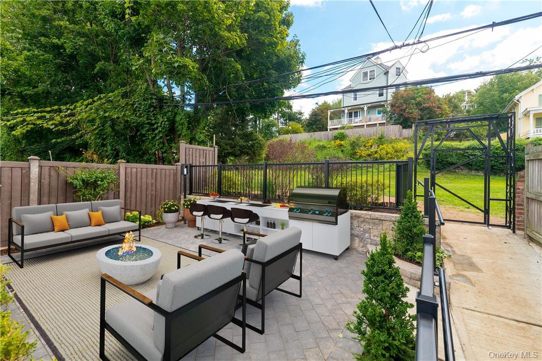 a view of a patio with couches and potted plants