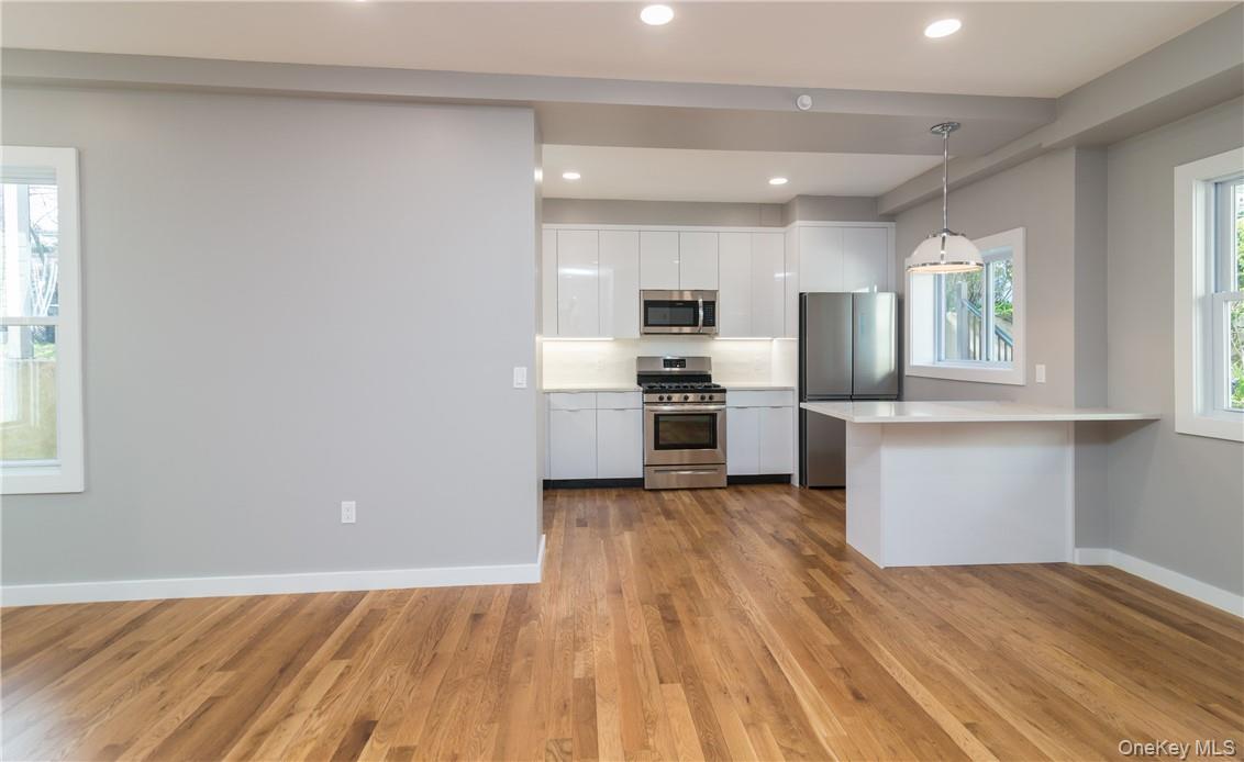 86 Main Street, Unit 3 Dobbs Ferry, NY 10522 - Photo 12 of 24 a view of kitchen with wooden floor electronic appliances and window