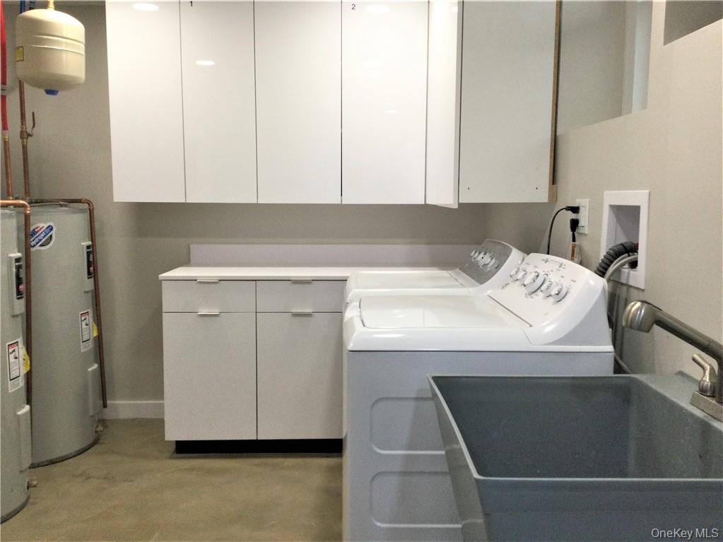 86 Main Street, Unit 3 Dobbs Ferry, NY 10522 - Photo 14 of 24 a utility room with washer and dryer