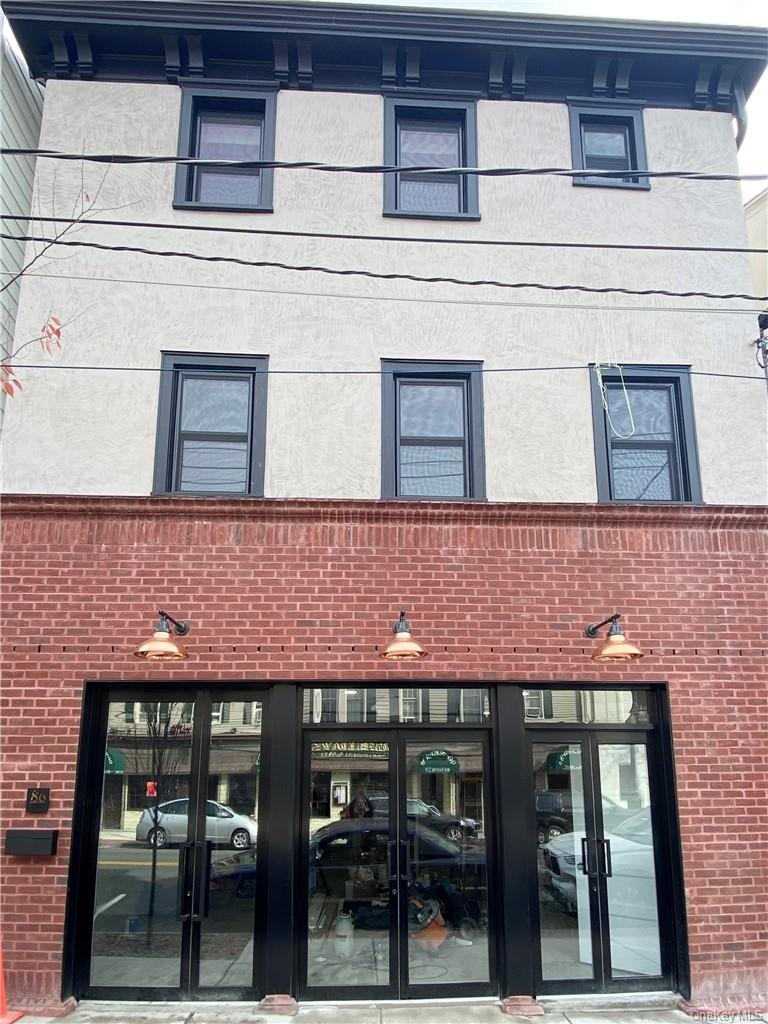 86 Main Street, Unit 3 Dobbs Ferry, NY 10522 - Photo 15 of 24 a front view of a building with glass windows