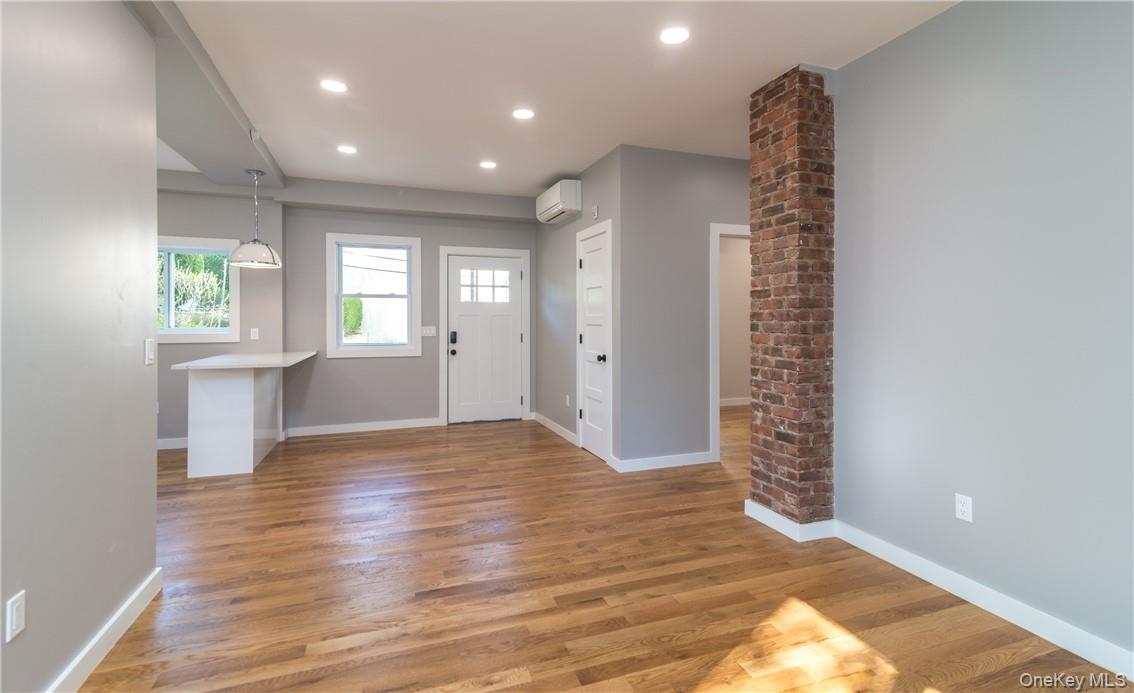 86 Main Street, Unit 3 Dobbs Ferry, NY 10522 - Photo 2 of 24 wooden floor in an empty room with a window