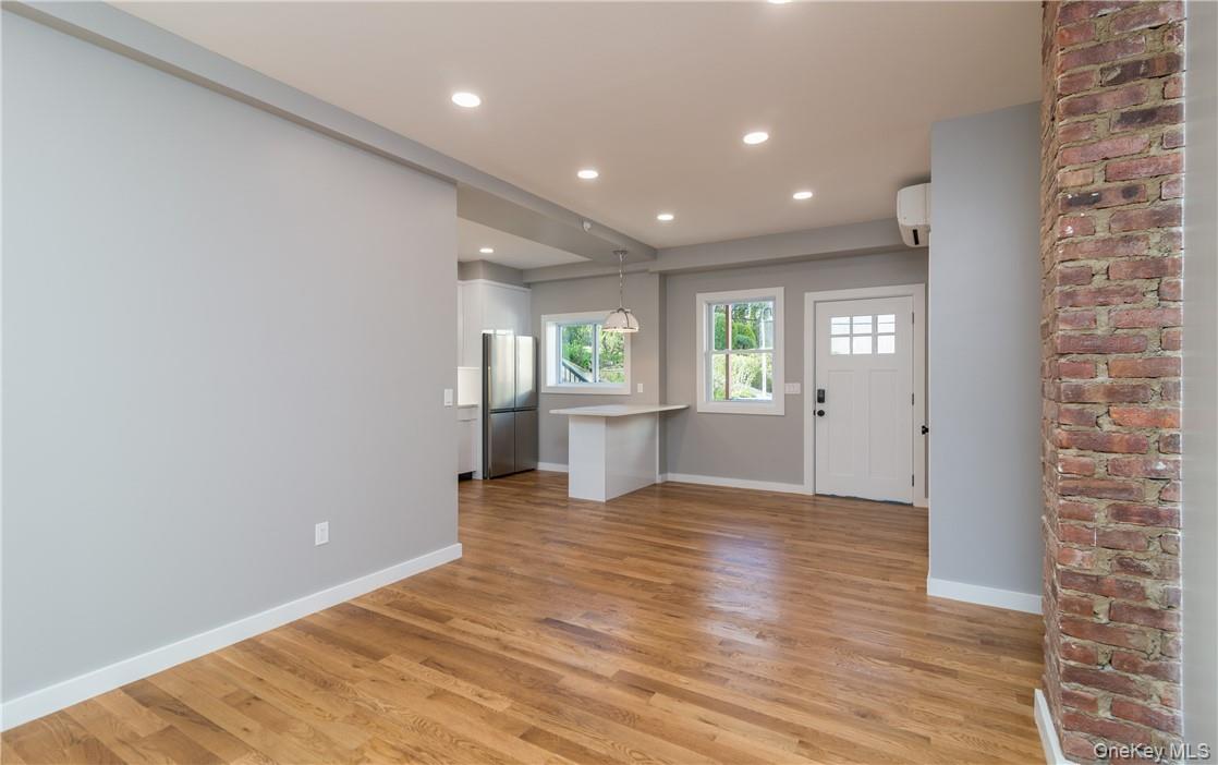 86 Main Street, Unit 3 Dobbs Ferry, NY 10522 - Photo 3 of 24 a view of a big room with wooden floor and windows