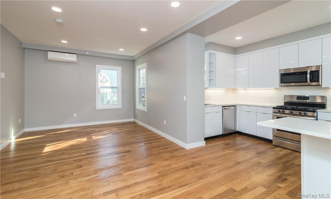 86 Main Street, Unit 3 Dobbs Ferry, NY 10522 - Photo 4 of 24 a view of kitchen with wooden floor and electronic appliances