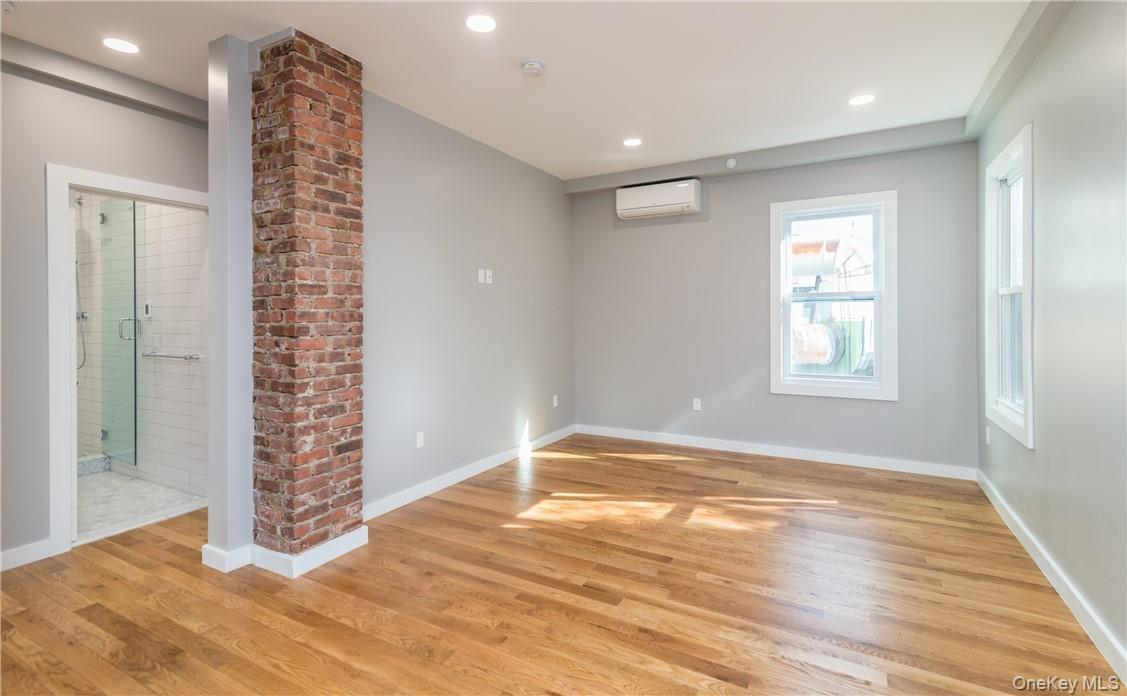 86 Main Street, Unit 3 Dobbs Ferry, NY 10522 - Photo 5 of 24 a view of an empty room with window and wooden floor