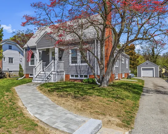 front view of a house with a yard