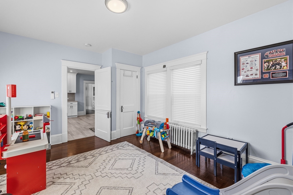 372 Buffinton Street Somerset, MA 02726 - Photo 15 of 33 a bed room with furniture and a wooden floor