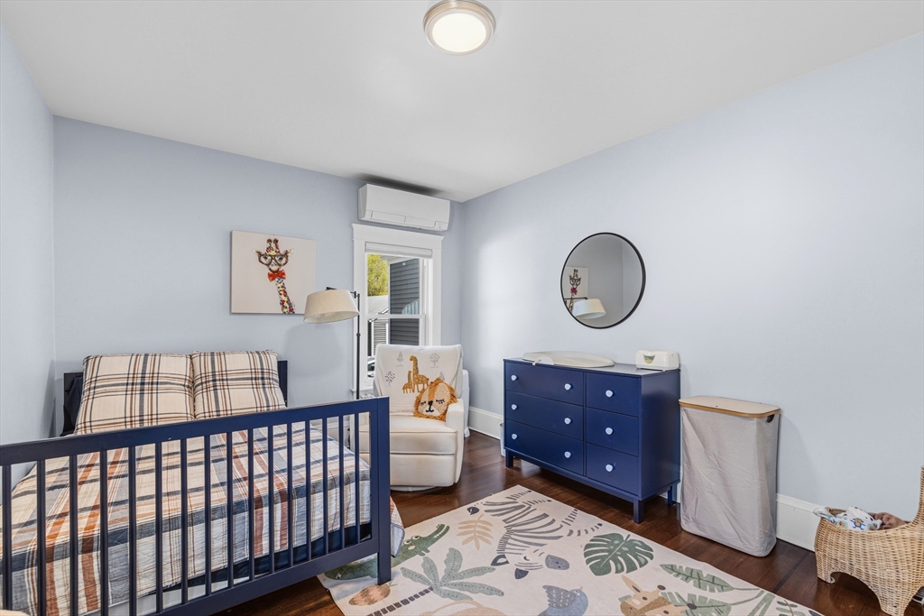 372 Buffinton Street Somerset, MA 02726 - Photo 19 of 33 a bedroom with a bed and wooden floor