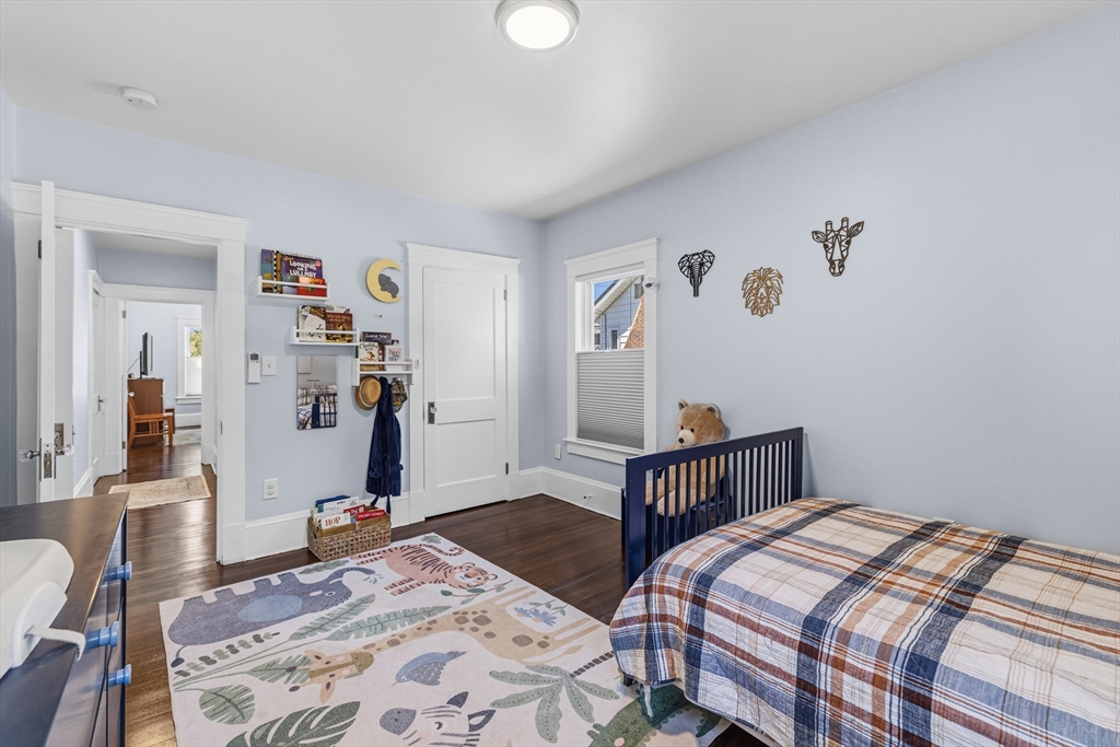 372 Buffinton Street Somerset, MA 02726 - Photo 20 of 33 a bedroom with a bed and wooden floor