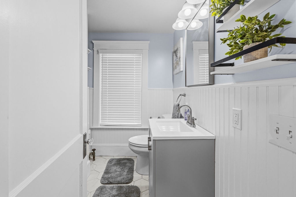 372 Buffinton Street Somerset, MA 02726 - Photo 22 of 33 a bathroom with a sink a toilet and a mirror