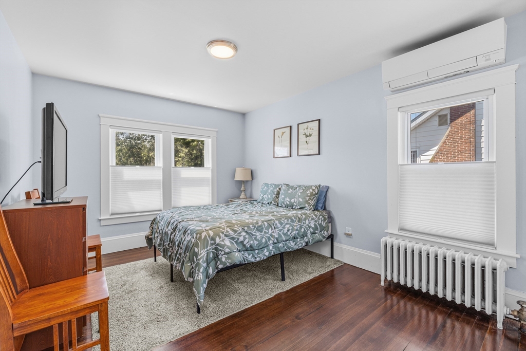 372 Buffinton Street Somerset, MA 02726 - Photo 23 of 33 a bedroom with a bed and wooden floor