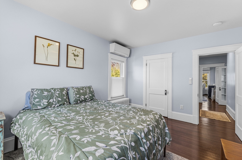 372 Buffinton Street Somerset, MA 02726 - Photo 25 of 33 a bedroom with a large bed and wooden floor