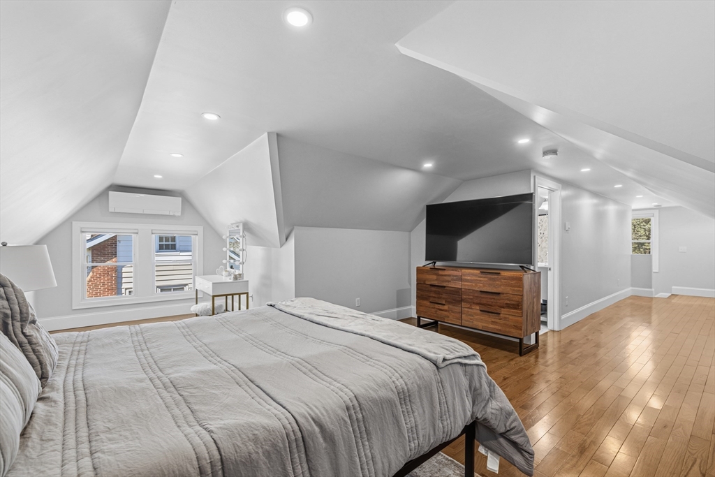 372 Buffinton Street Somerset, MA 02726 - Photo 28 of 33 a bedroom with furniture and a flat screen tv