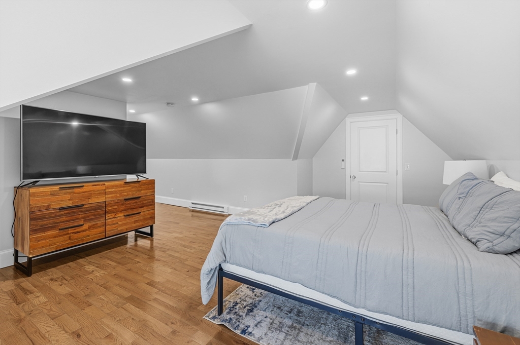 372 Buffinton Street Somerset, MA 02726 - Photo 29 of 33 a bedroom with a bed and a flat screen tv