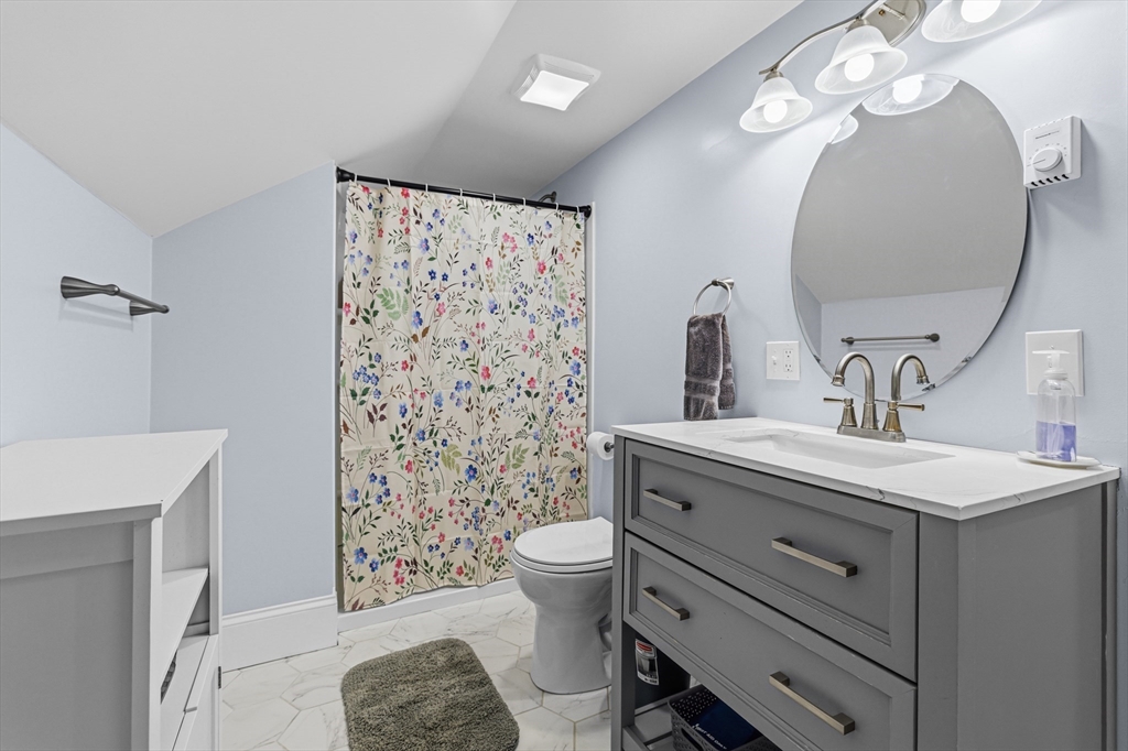 372 Buffinton Street Somerset, MA 02726 - Photo 3 of 33 a bathroom with a sink a toilet and a mirror