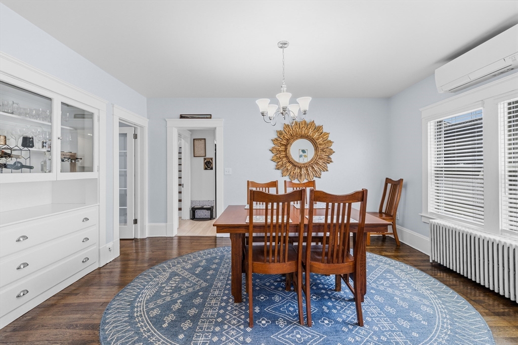 372 Buffinton Street Somerset, MA 02726 - Photo 5 of 33 a view of a dining room and hall with wooden floor