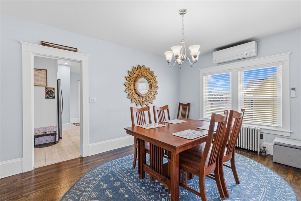 372 Buffinton Street Somerset, MA 02726 - Photo 10 of 33 a dining room with furniture a chandelier and wooden floor