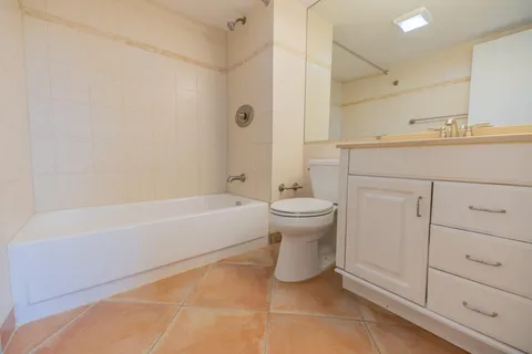 a spacious bathroom with a bathtub sink and toilet