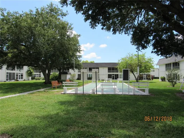 a view of a house with a backyard porch and sitting area