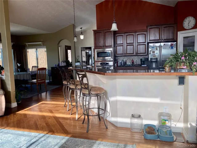 a bedroom with a bed and a potted plant