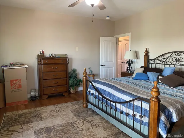 a bathroom with a sink a mirror and a clock on the wall