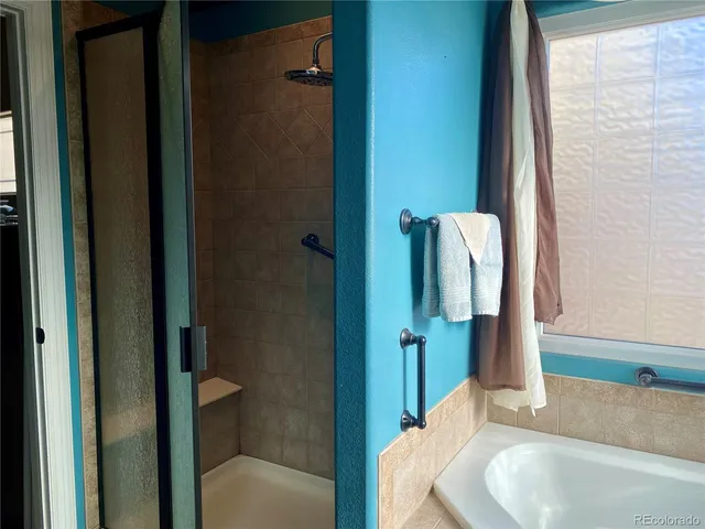 a view of a dining room with furniture wooden floor and a chandelier