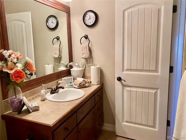 a kitchen with stainless steel appliances granite countertop a sink a stove and cabinets
