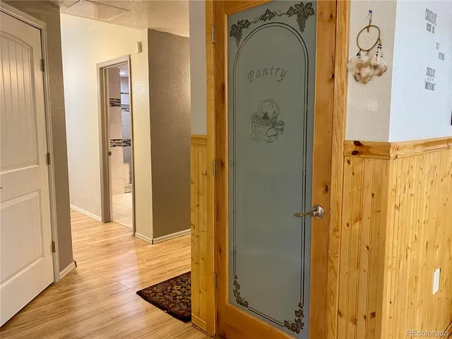 a view of a garden with wooden fence