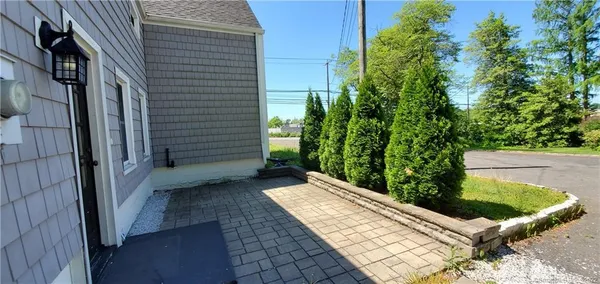 a view of a backyard with sitting area