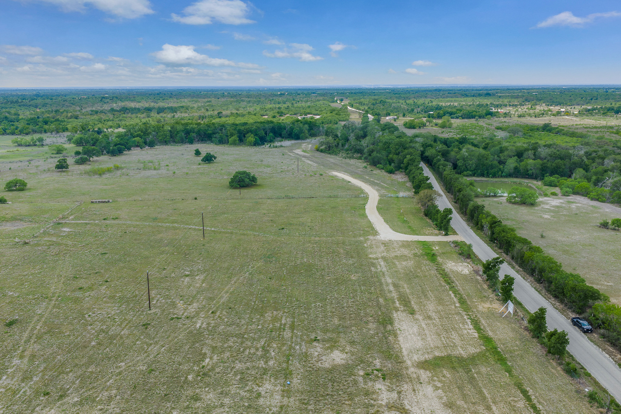 Lot 16 Mineral Springs Road Lockhart, TX 78644 - Photo 6 of 7 Expansive open land featuring diverse foliage and a clear sky