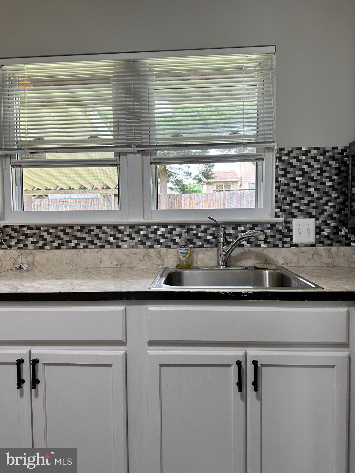 8336 Scotts Level Road Baltimore, MD 21208 - Photo 14 of 55 Bright kitchen with modern finishes.