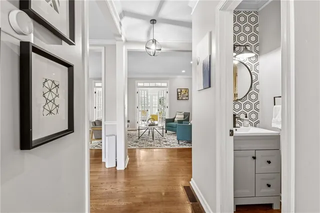 a spacious bedroom with a bed and wooden floor