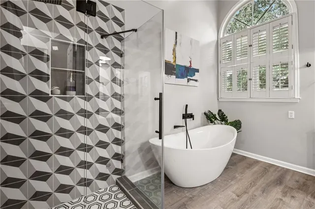 a bedroom with a bed and a table with chair