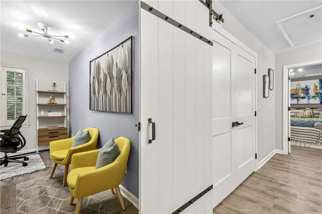 a view of house with outdoor space and sitting area