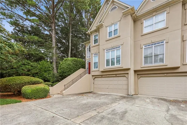 a view of a balcony with two chairs and a table