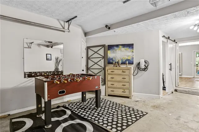a view of a deck with wooden floor a yard tables and chairs