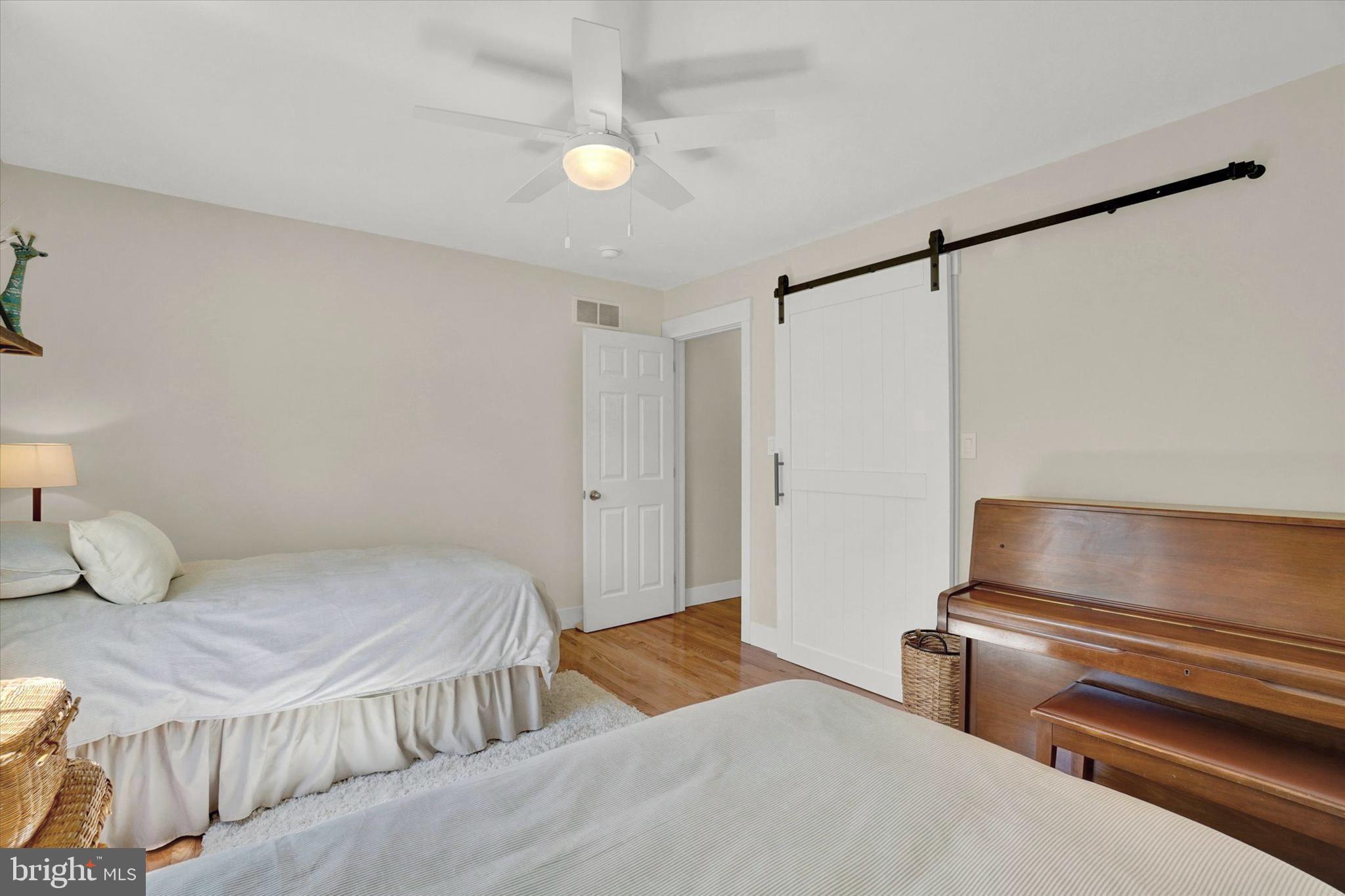 669 Woodburne Road Lewisberry, PA 17339 - Photo 16 of 44 a bedroom with a bed and a chair