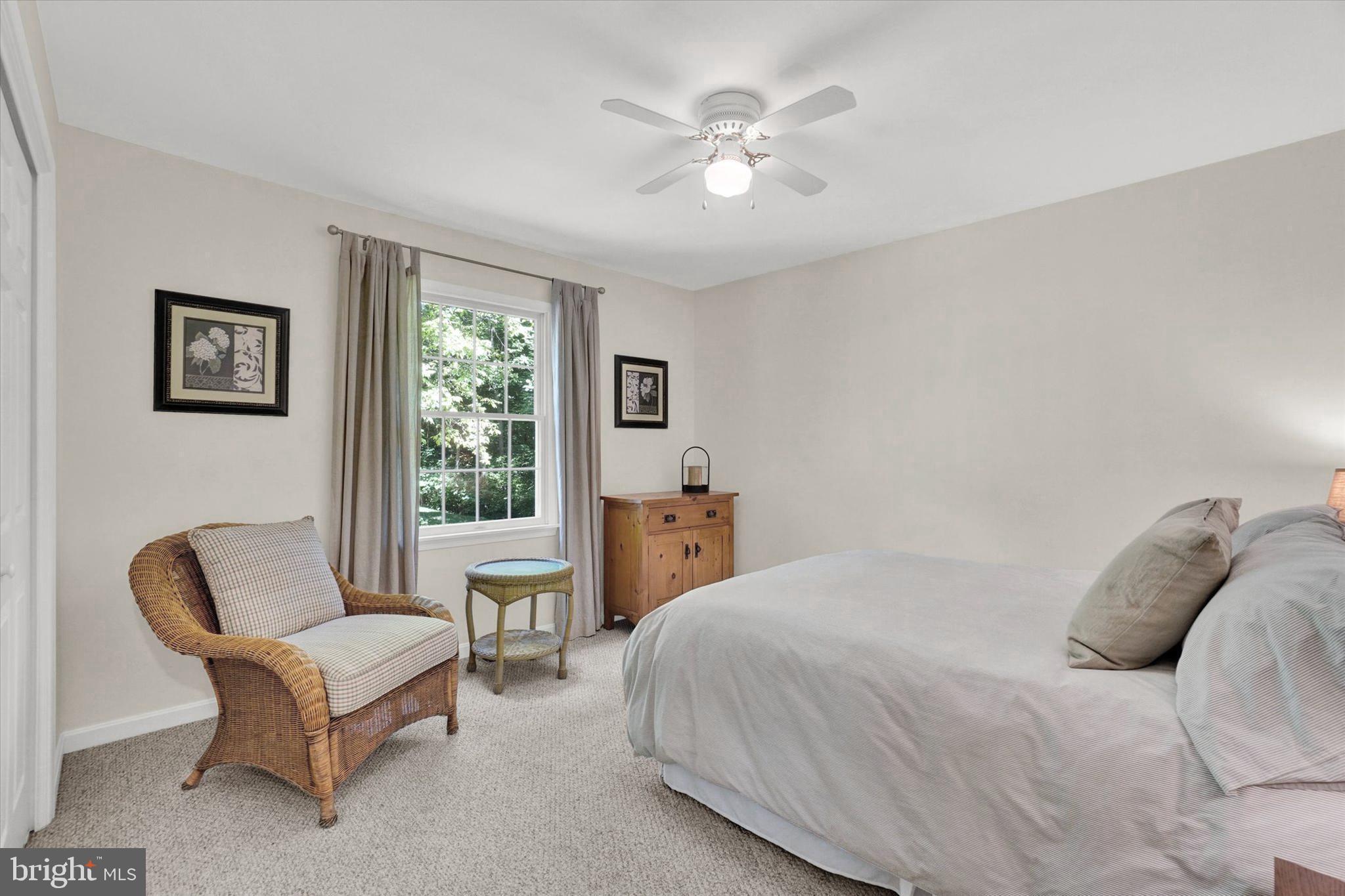 669 Woodburne Road Lewisberry, PA 17339 - Photo 17 of 44 a bedroom with a bed a couch and a window