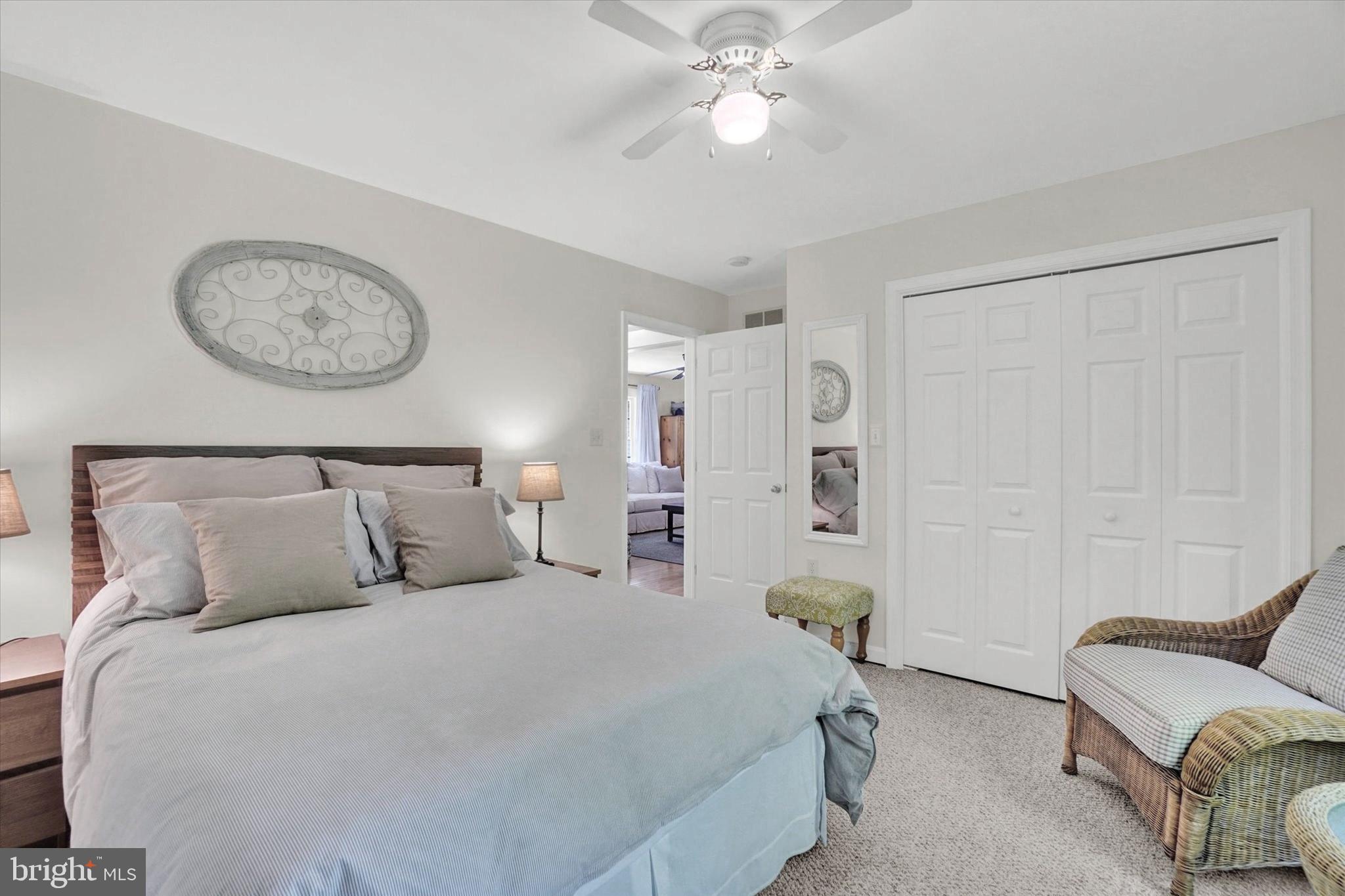 669 Woodburne Road Lewisberry, PA 17339 - Photo 18 of 44 a bedroom with a bed and a chandelier