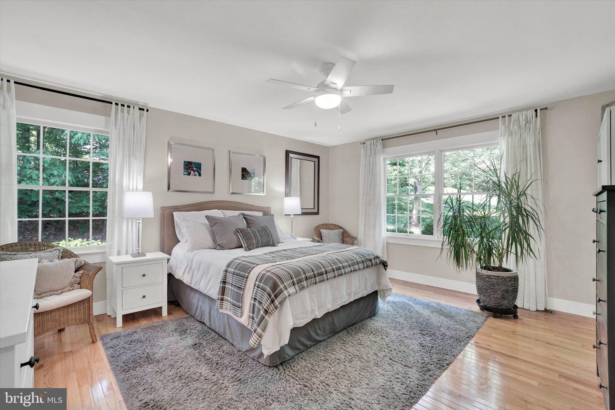 669 Woodburne Road Lewisberry, PA 17339 - Photo 19 of 44 a spacious bedroom with a large bed and a large window
