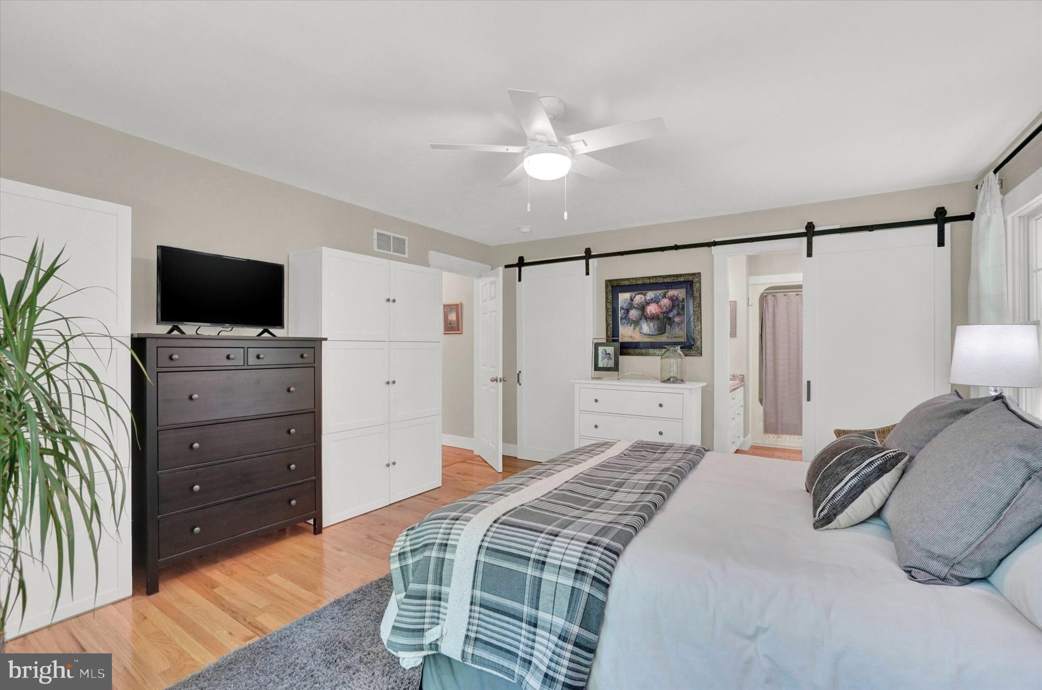 669 Woodburne Road Lewisberry, PA 17339 - Photo 20 of 44 a bedroom with a bed and a flat screen tv