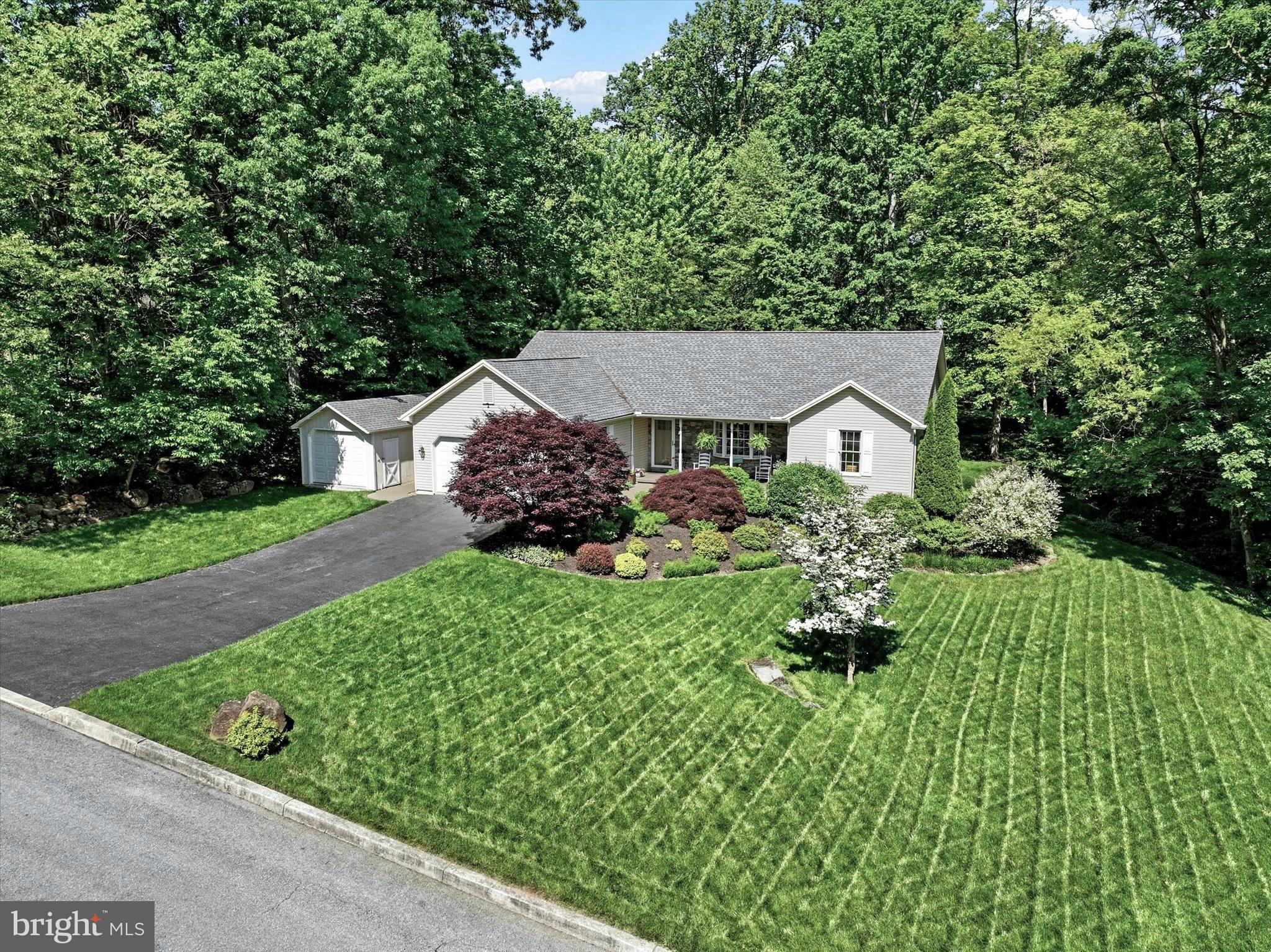 669 Woodburne Road Lewisberry, PA 17339 - Photo 2 of 44 a view of a garden with plants