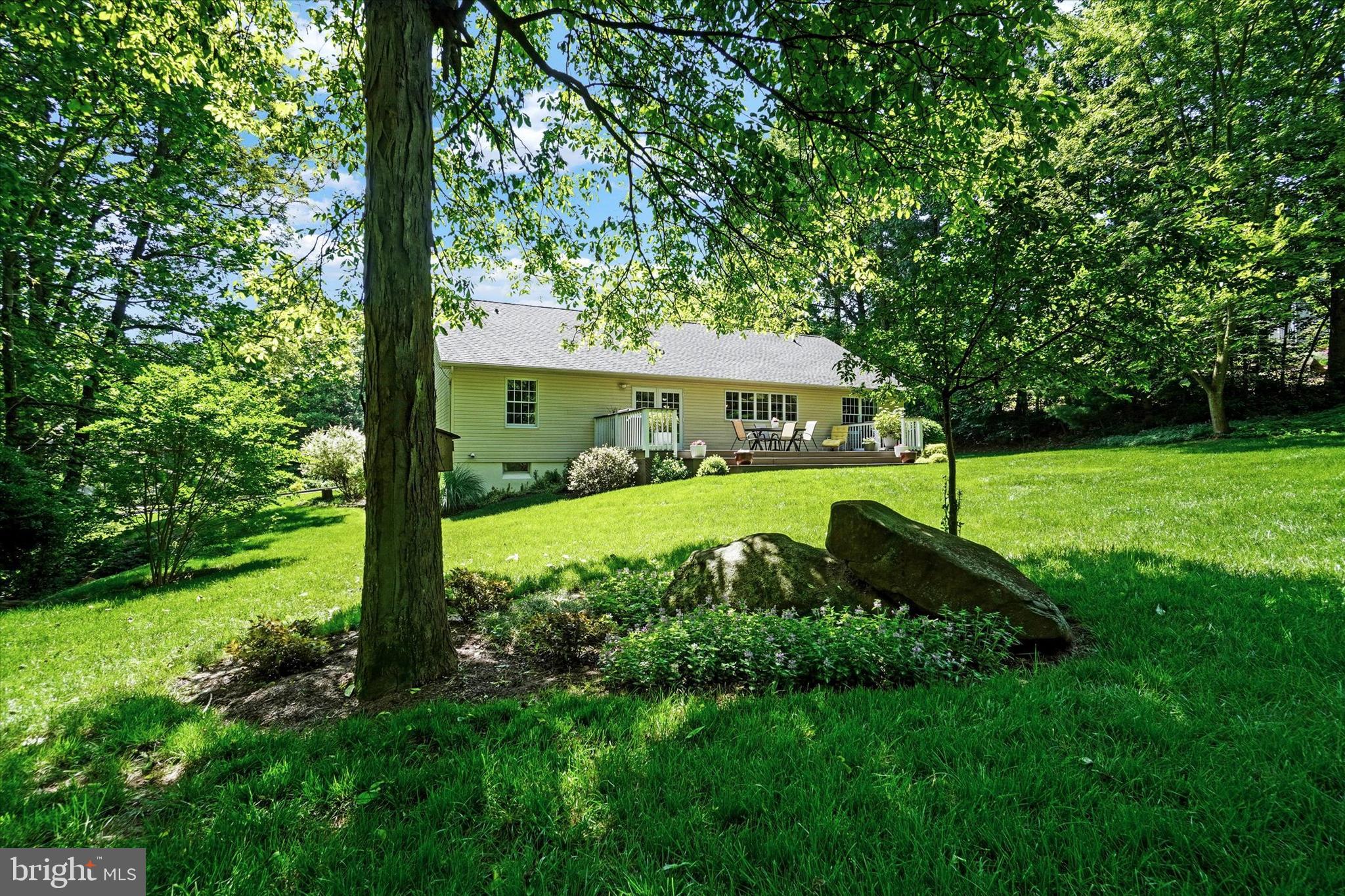669 Woodburne Road Lewisberry, PA 17339 - Photo 33 of 44 a view of an house with backyard and a tree
