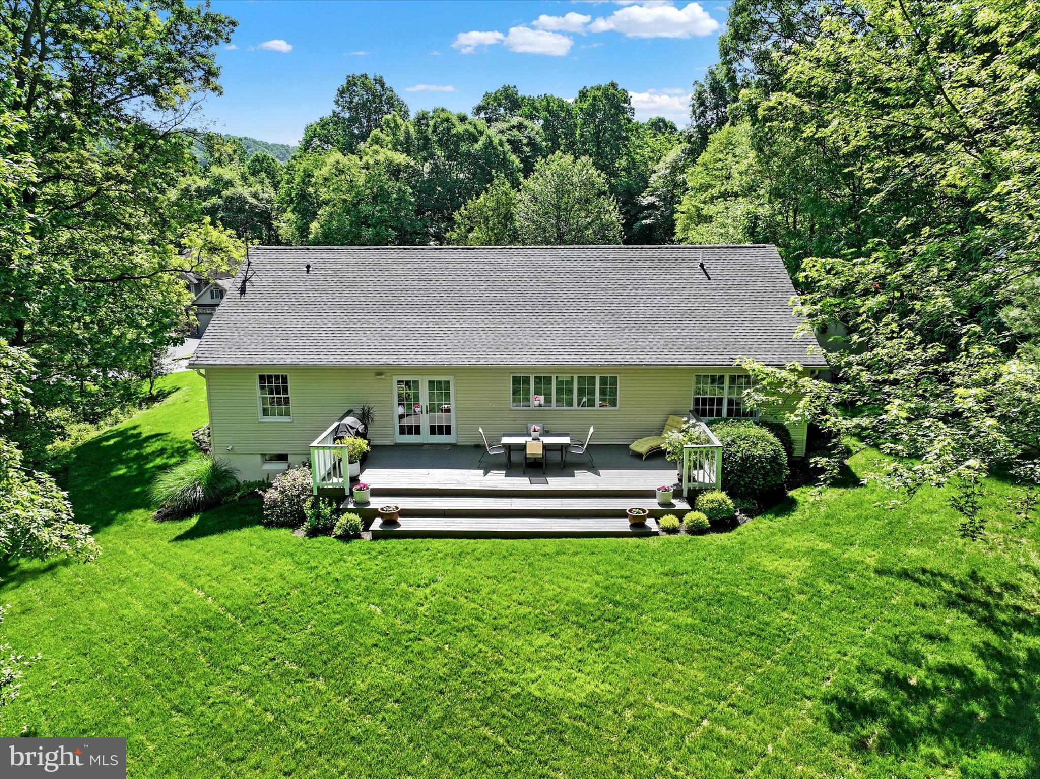 669 Woodburne Road Lewisberry, PA 17339 - Photo 35 of 44 a view of house with backyard and outdoor seating