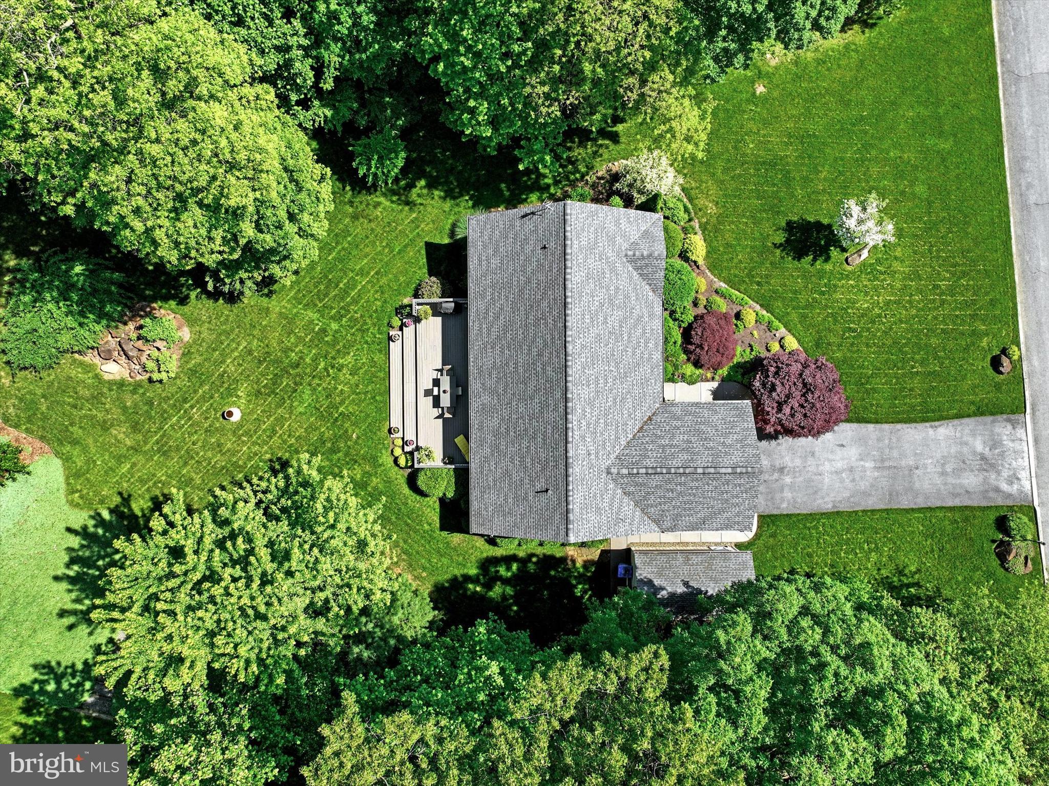 669 Woodburne Road Lewisberry, PA 17339 - Photo 40 of 44 an aerial view of a house with a yard and lake view