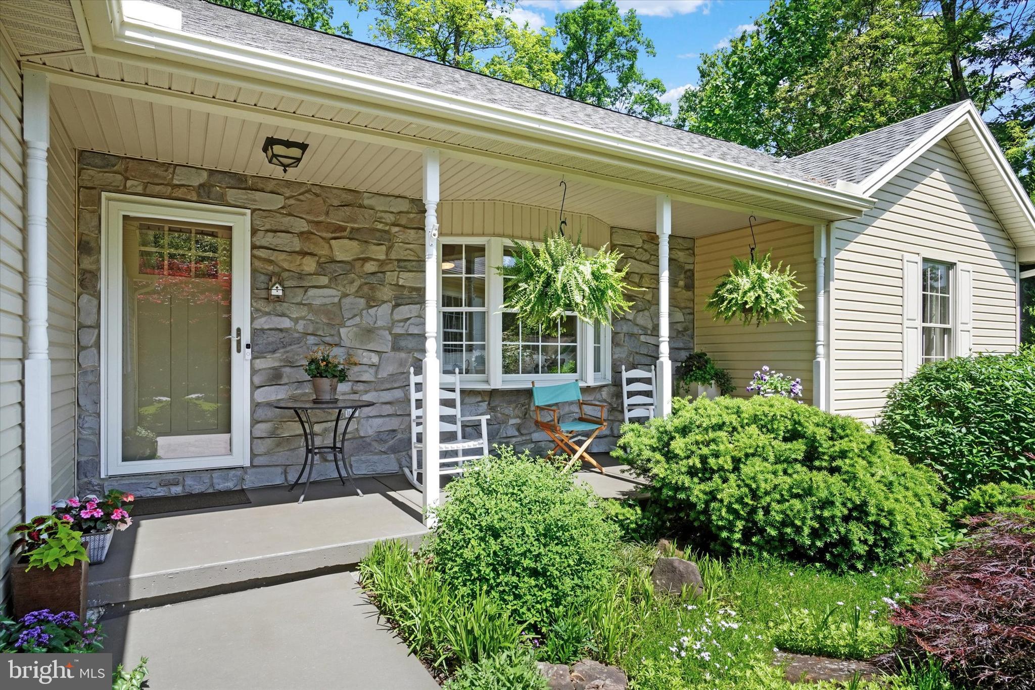 669 Woodburne Road Lewisberry, PA 17339 - Photo 4 of 44 a house with a garden view