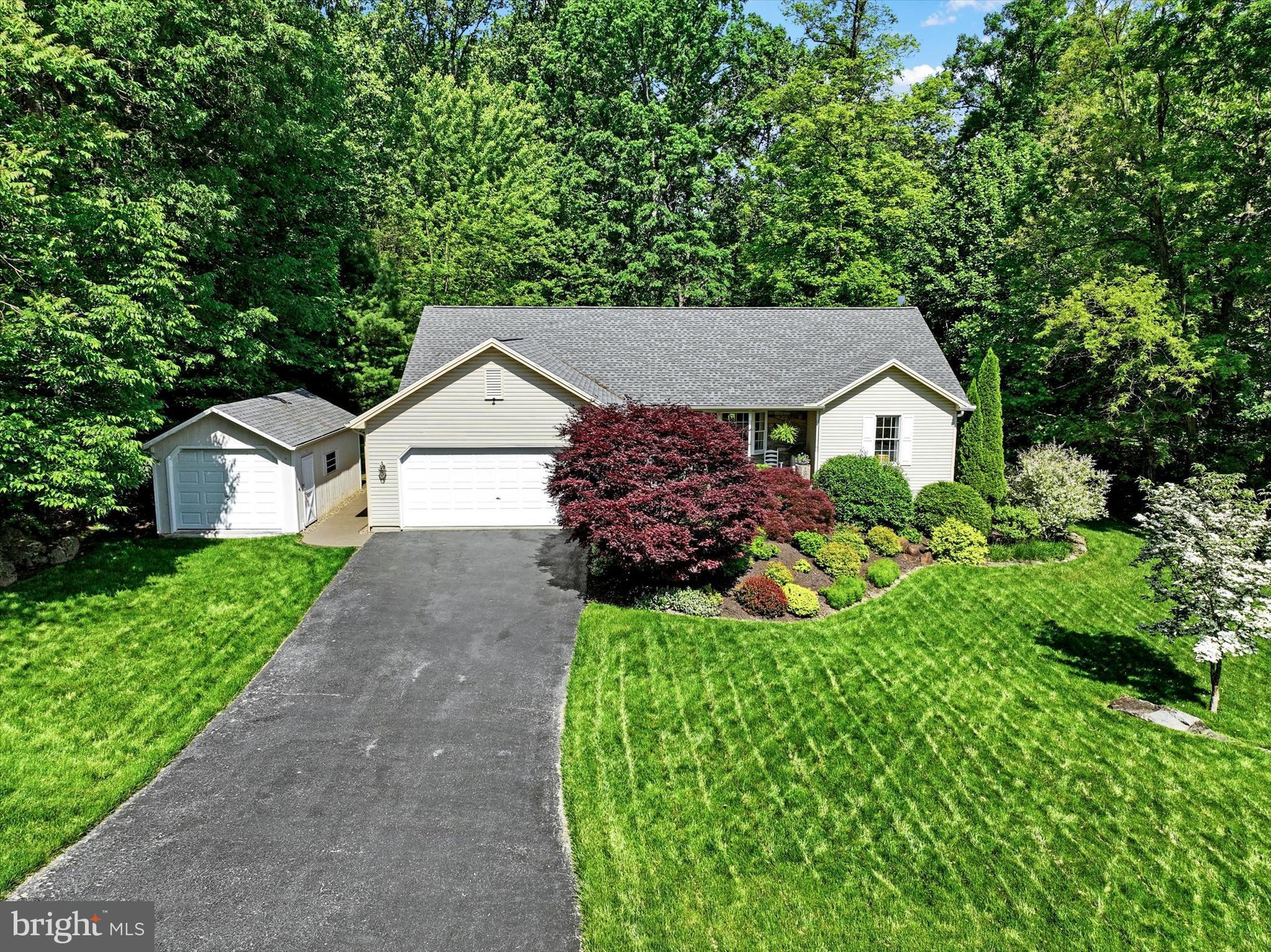 669 Woodburne Road Lewisberry, PA 17339 - Photo 41 of 44 a front view of house with garden