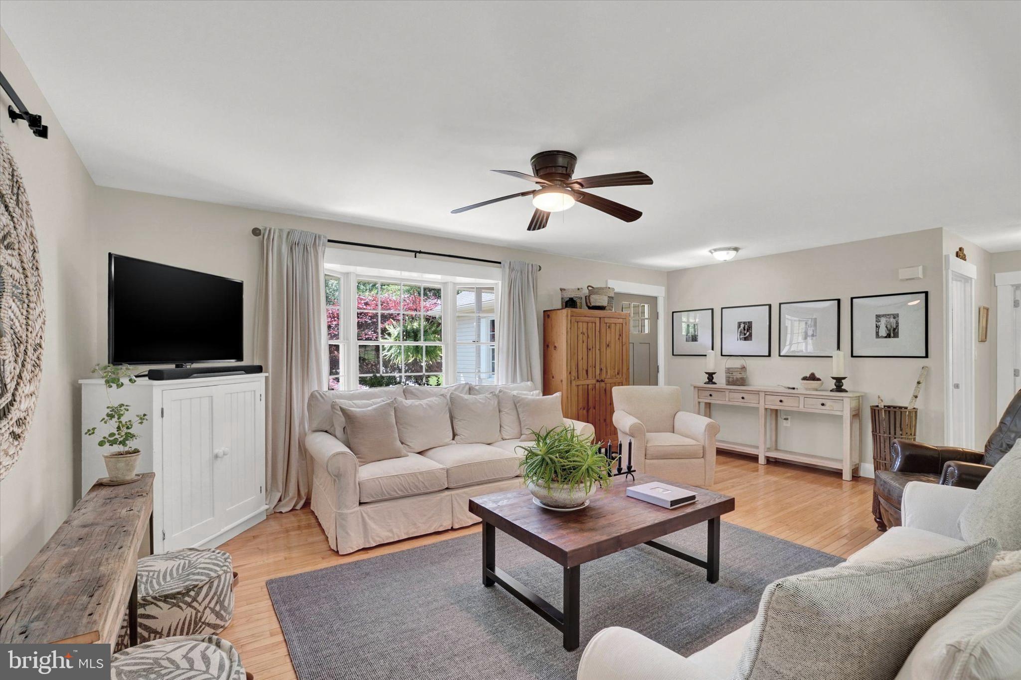 669 Woodburne Road Lewisberry, PA 17339 - Photo 6 of 44 a living room with furniture and a flat screen tv