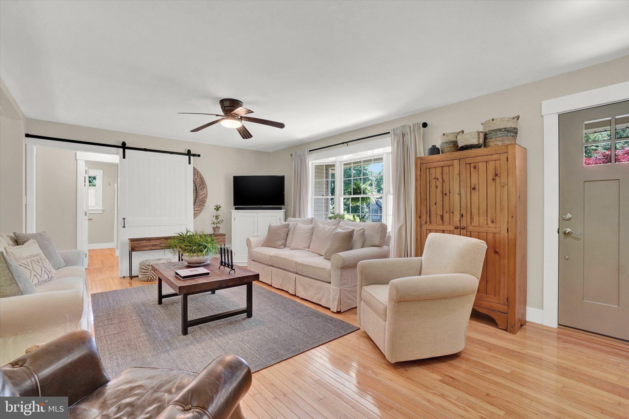 669 Woodburne Road Lewisberry, PA 17339 - Photo 7 of 44 a living room with furniture and a flat screen tv